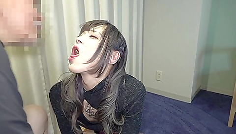 Japanese tattooed babe with a big dick in the mouth