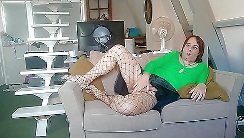 French naked brunette with red hair gets herself wet