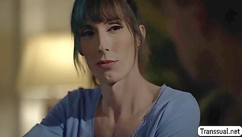 Hot transvestite with a nice tattoo gets fucked on the bed